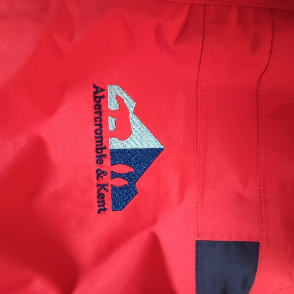 The iconic Abercrombie & Kent expedition red winter coat with blue lining. - Picture 4 of 10